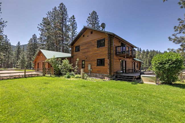 front view of house featuring a balcony, a wooden deck, and log exterior | Image 46