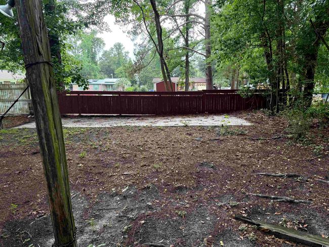 View of fenced backyard | Image 21