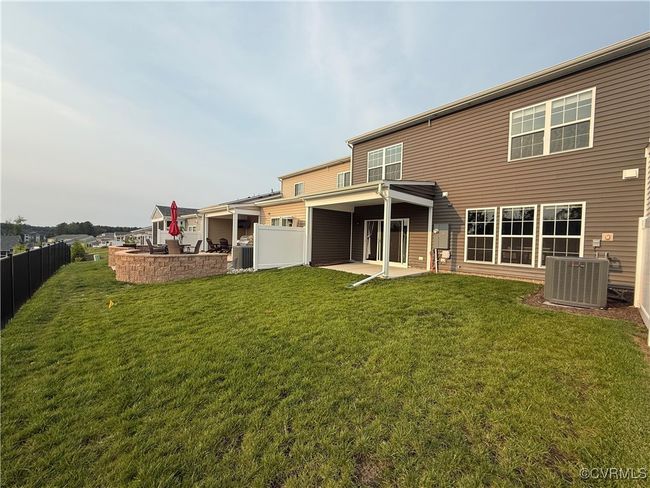 Back of house featuring central AC unit and a patio area | Image 24