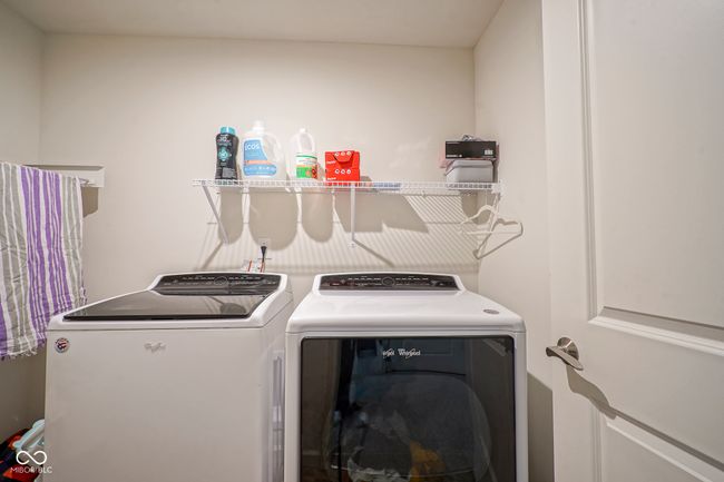 clothes washing area with washer and dryer and laundry area | Image 35