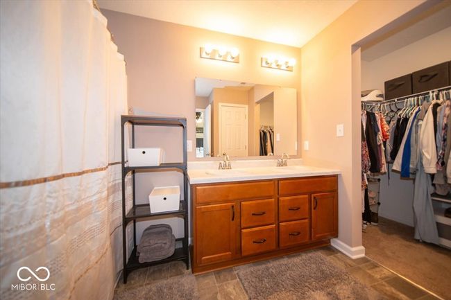 bathroom with double vanity and a spacious closet | Image 18