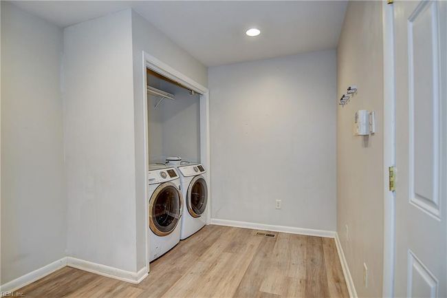 Very large laundry room has room for additional shelving or storage. | Image 35
