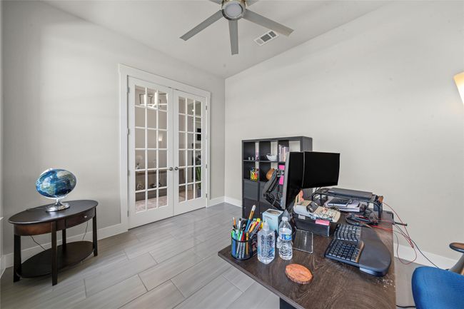 Office area with french doors, ceiling fan, and wood finish floors | Image 25