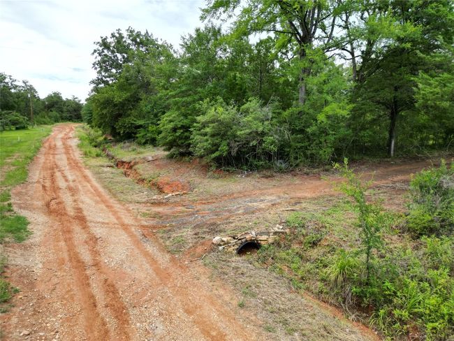 View of dirt / gravel road | Image 6