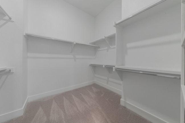 Spacious closet with carpet | Image 27