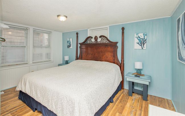 Bedroom with wood-type flooring and a textured ceiling | Image 19