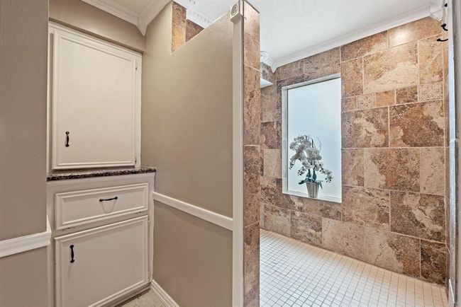 Primary bathroom is updated with large walk in shower. | Image 19