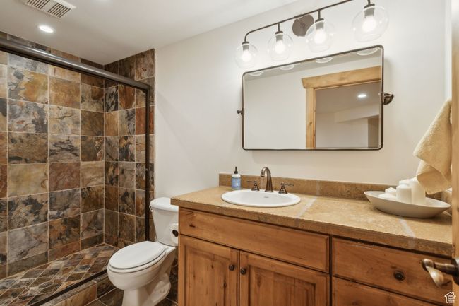 Full bath featuring vanity, toilet, and a stall shower | Image 44