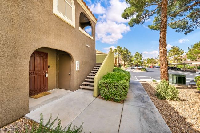 View of exterior entry with stucco siding | Image 13