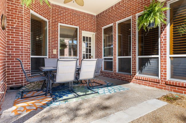 View of patio featuring outdoor dining area and a ceiling fan | Image 29