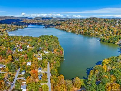 Bird's eye view featuring a water and mountain view | Image 2