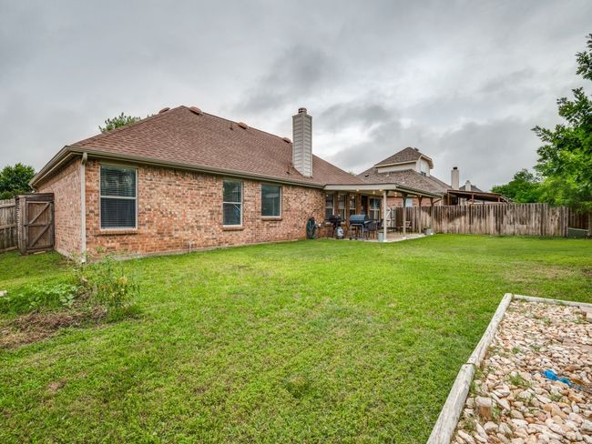 Back view of home with covered patio | Image 24