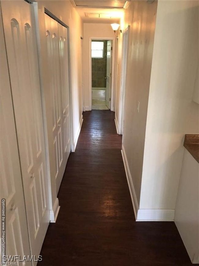Hallway featuring dark hardwood / wood-style flooring | Image 7