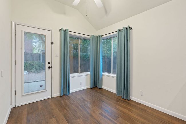 A flexible bonus space just off the kitchen suits a variety of needs, whether it’s a breakfast nook, workspace, or play area. | Image 18
