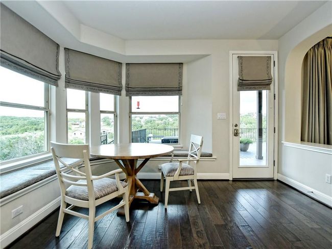 Dining room featuring plenty of natural light, dark wood-style flooring, and breakfast area | Image 6