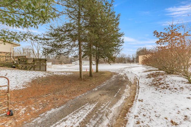 Driveway leading to backyard | Image 33