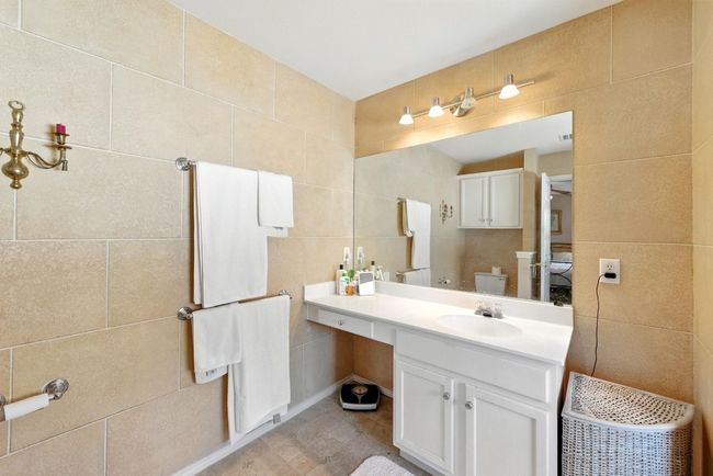 Bathroom featuring tile walls and vanity | Image 20