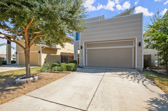 From the moment you arrive, the captivating curb appeal, framed by lush, mature landscaping, invites you to explore the thoughtfully designed interior. | Image 22