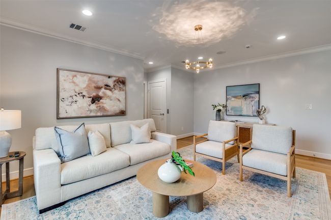 Living area featuring crown molding, a chandelier, wood finished floors, baseboards, and recessed lighting | Image 5