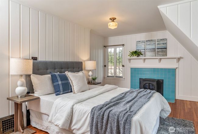 Upstairs primary BR with Fireplace. | Image 16