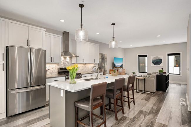 Mosaic slate tiled backsplash and stainless steel appliances | Image 4