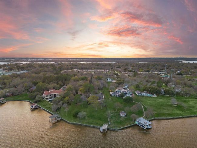 This exclusive estate is not just a home; it's a lifestyle offering that rare blend of convenience, privacy, and nature—a perfect sanctuary for the discerning buyer seeking the ultimate lakeside living experience. | Image 48