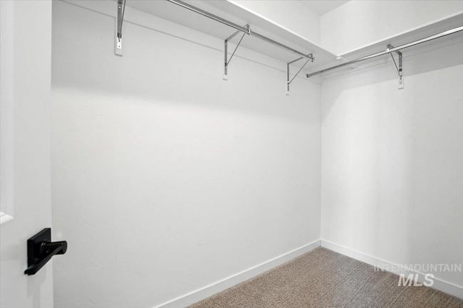 Walk in closet featuring carpet flooring | Image 22