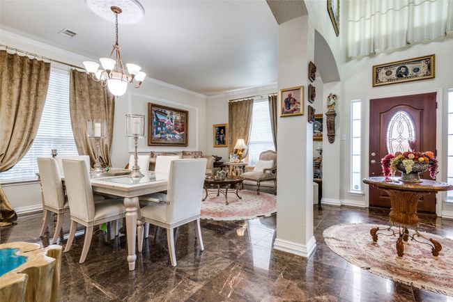 View of the entry with large foyer opening into formal living and dining rooms with beautiful, upgraded tile. | Image 6