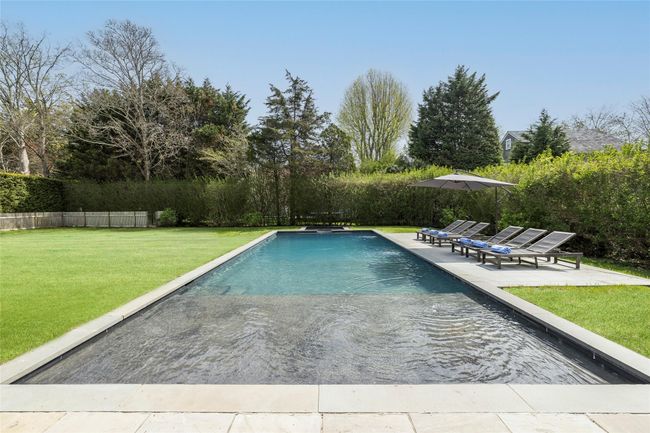 View of pool featuring fence, a patio, a fenced in pool, and a lawn | Image 5