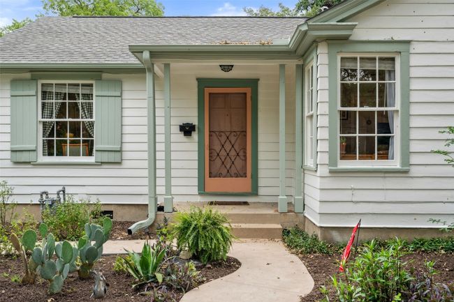 Beautiful front of house with landscaped front yard and tall trees | Image 22