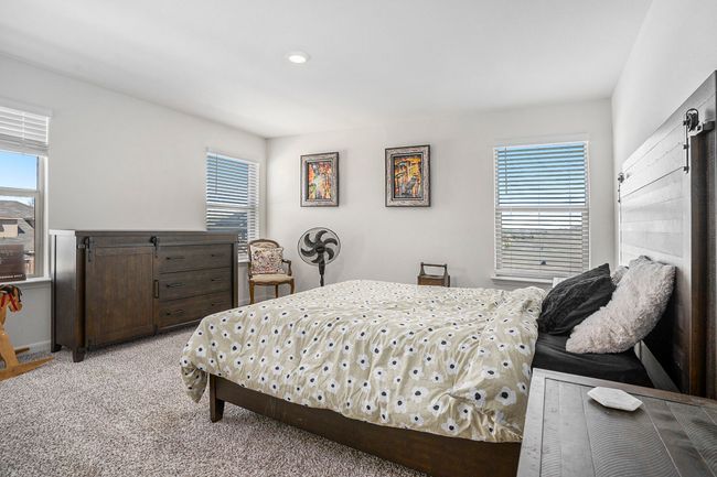 Bedroom with light carpet. | Image 19