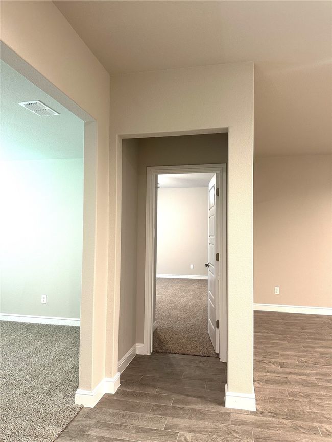 Corridor with wood finished floors and baseboards | Image 8