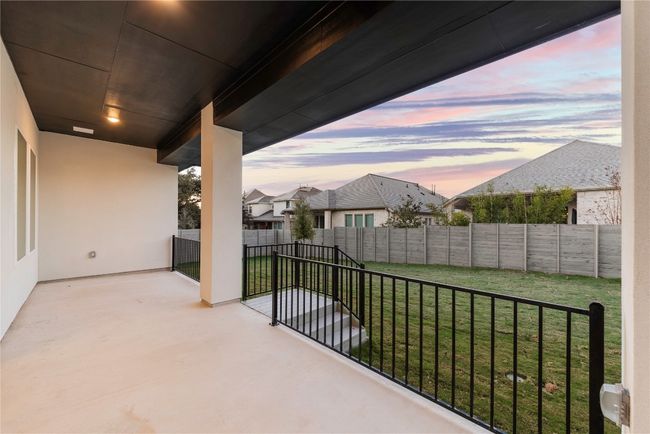 View of fenced backyard | Image 10