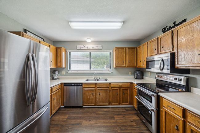 Kitchen featuring stainless steel appliances including a double oven. | Image 9