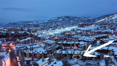 Snowy aerial view featuring a mountain view | Image 1