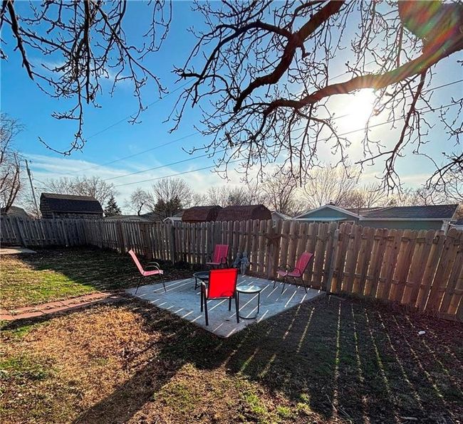 Oversized yard features Covered patio, additional seating area and basket ball goal with cement pad | Image 31