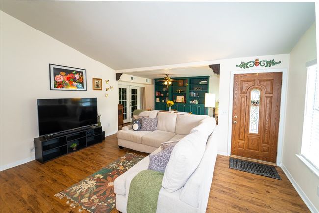 Living room with plenty of natural light, lofted ceiling, and french doors | Image 8