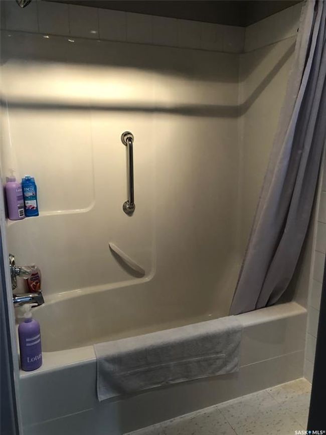 Bathroom view of shower / bath combination with curtain | Image 31