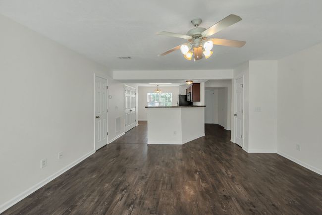 A view from the den back toward the kitchen and the foyer | Image 15