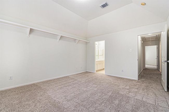This view shows the connecting jack and jill bathroom, and private vanity area and closet for this bedroom! | Image 30
