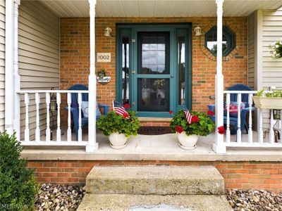 Entrance to property featuring a porch | Image 2