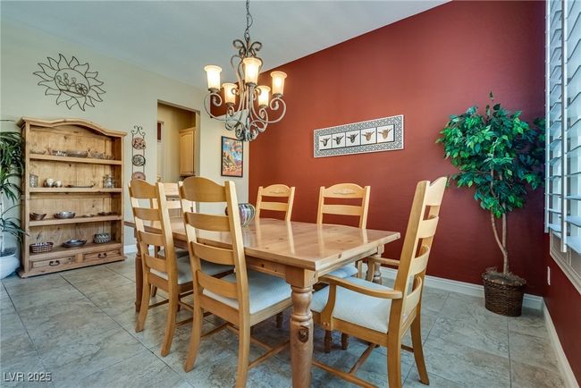 Dining space with baseboards and a chandelier | Image 18
