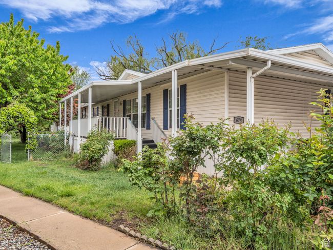 View of home's exterior featuring large lot and covered porch | Image 22