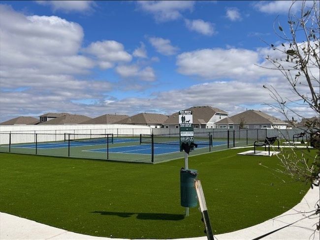 View of tennis court with a residential view | Image 15