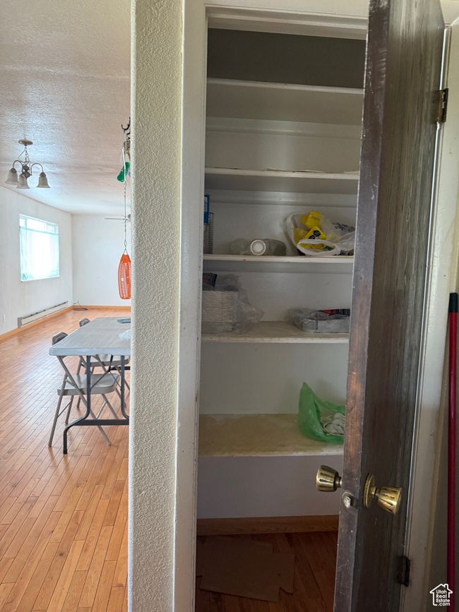 Closet with baseboard heating | Image 12