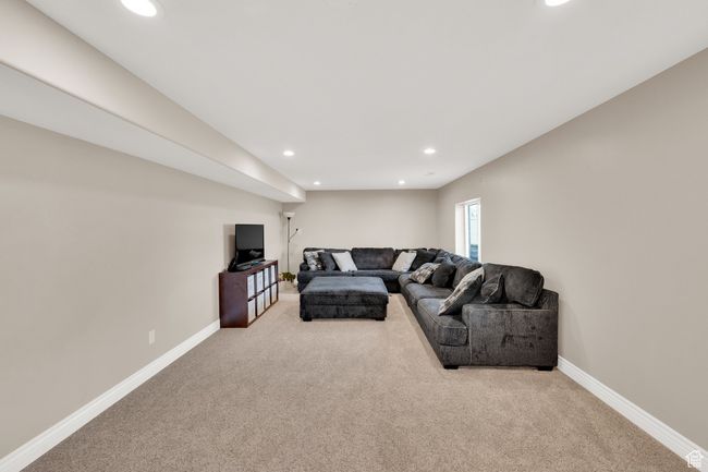 Carpeted living room with recessed lighting and baseboards | Image 16