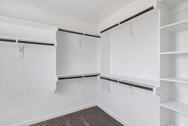 Spacious closet featuring carpet floors | Image 26