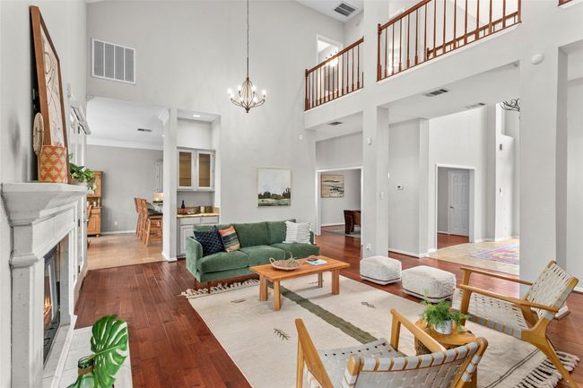 Hard wood floor and tumbled travertine flooring make the spaces warm and comfortable | Image 5