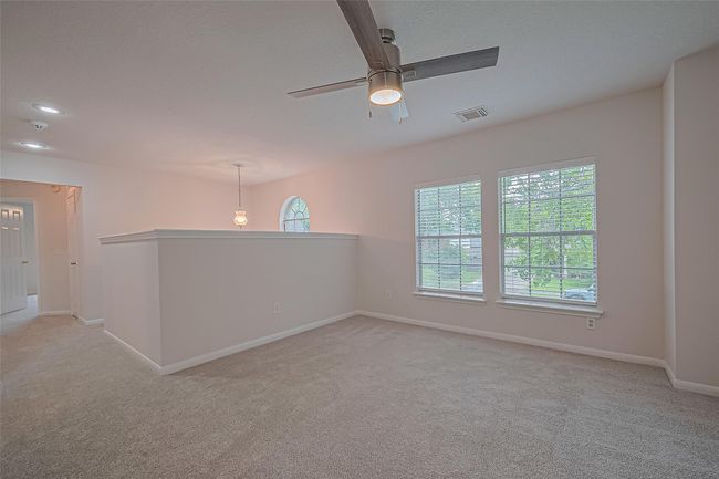 Upstairs loft area features all new carpet, freshly painted walls and ceilings, and offers a versatile space for lounging, working, or play. | Image 24