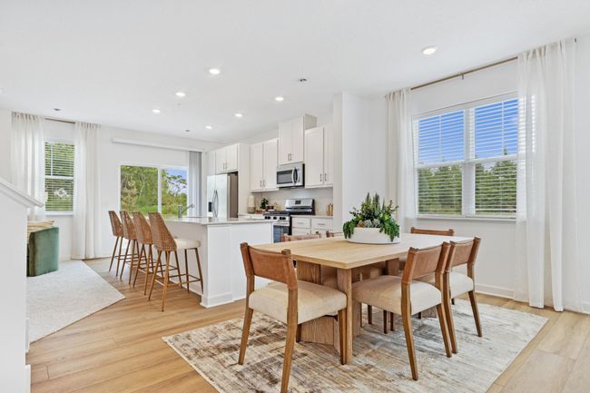 (Photo of decorated model, actual home's finishes will vary) Soaked in natural sunlight, the homes dining room has ample room for a dining table located in the heart of the home. | Image 5